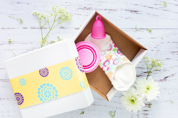 Pink menstrual cup in a box.