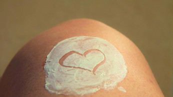 White heart shape on human skin.