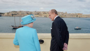 Britain's Queen Elizabeth and Prince Philip, the Duke of Edinburgh, visit the harbour of Valletta during the Commonwealth Heads of Government Meeting in Valletta