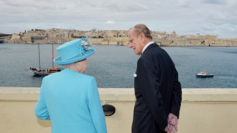 Britain's Queen Elizabeth and Prince Philip, the Duke of Edinburgh, visit the harbour of Valletta during the Commonwealth Heads of Government Meeting in Valletta