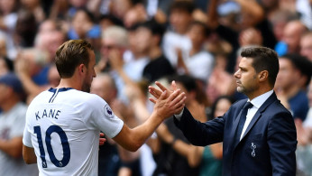 Tottenham's Harry Kane shakes hands with manager Mauricio Pochettino after being substituted 
