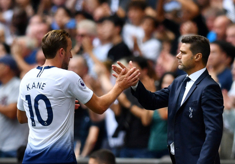 Tottenham's Harry Kane shakes hands with manager Mauricio Pochettino after being substituted 