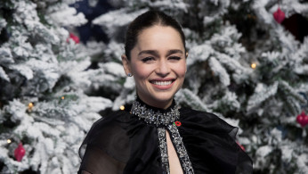 Actor Emilia Clarke poses looks as she arrives for the U.K. premiere of 