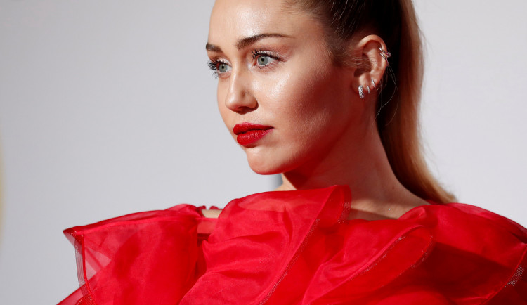 FILE PHOTO: Singer Miley Cyrus poses at the premiere for the movie "Isn't It Romantic" in Los Angeles, California, U.S., February 11, 2019. 