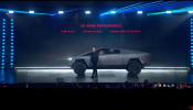 Tesla Chief Executive Elon Musk stands in front of the company's first electric pickup truck, the Cybertruck, after it was unveiled in Los Angeles
