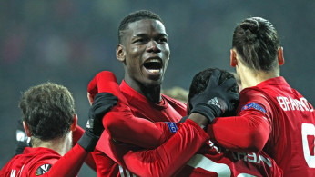 Paul Pogba celebrating a goal with his Manchester United team-mates during Europa League