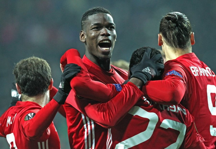 Paul Pogba celebrating a goal with his Manchester United team-mates during Europa League