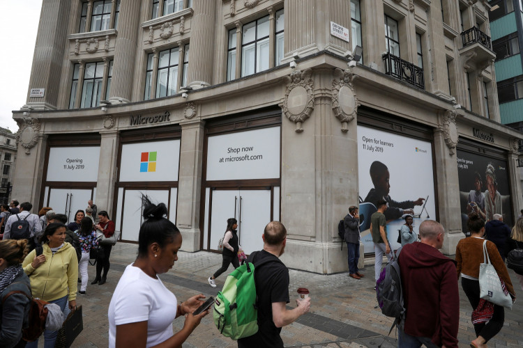Pedestrians walk past Microsoft's new Oxford Circus store ahead of its opening in London