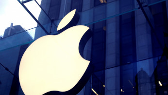 The Apple Inc. logo is seen hanging at the entrance to the Apple store on 5th Avenue in New York