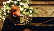 FILE PHOTO: Elton John sings a rewritten version of his song 'Candle in the wind' as a tribute to Diana, Princess of Wales at her funeral in London's Westminster Abbey