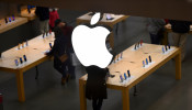 An Apple logo is seen at an Apple store as pre-Thanksgiving and Christmas holiday shopping accelerates at the King of Prussia Mall in King of Prussia