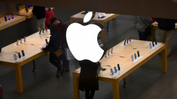 An Apple logo is seen at an Apple store as pre-Thanksgiving and Christmas holiday shopping accelerates at the King of Prussia Mall in King of Prussia