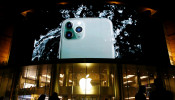 Screen displaying an advertisement for iPhone 11 Pro is seen outside an Apple store in Beijing