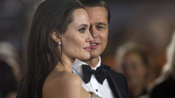 FILE PHOTO: Director and cast member Jolie and her husband and co-star Pitt pose at the premiere of 
