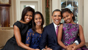 The Obama family in the Oval Office.