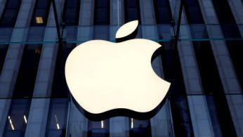 The Apple Inc. logo is seen hanging at the entrance to the Apple store on 5th Avenue in New York