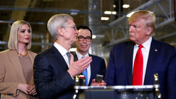 Apple CEO Tim Cook speaks with U.S. President Donald Trump as he tours Apple's Mac Pro manufacturing plant with White House senior advisor Ivanka Trump and Tresury Secretary Steven Mnuchin in Austin, Texas, U.S., November 20, 2019. REUTERS/Tom Brenner