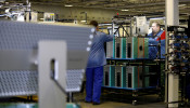 Flextronics International Apple factory employees work on Apple Mac Pro computer assembly in Austin, TX
