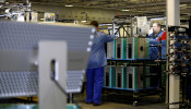 Flextronics International Apple factory employees work on Apple Mac Pro computer assembly in Austin, TX