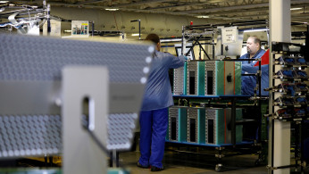 Flextronics International Apple factory employees work on Apple Mac Pro computer assembly in Austin, TX
