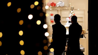 People look at a shop window