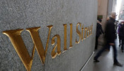 A street sign, Wall Street, is seen outside New York Stock Exchange (NYSE) in New York City, New York