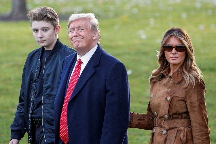 U.S. President Donald Trump walks with son Barron and first lady Melania Trump as they depart for travel to Florida from the South Lawn of the White House in Washington, U.S., November 26, 2019. REUTERS/Tom Brenner