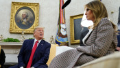 U.S. President Donald Trump speaks next to first lady Melania Trump