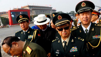 Military delegates arrive before a military parade marking the 70th founding anniversary of People's Republic of China, on its National Day in Beijing,
