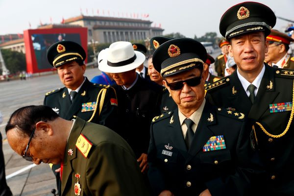 Military delegates arrive before a military parade marking the 70th founding anniversary of People's Republic of China, on its National Day in Beijing,