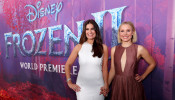 Cast members Idina Menzel (L) and Kristen Bell pose at the premiere for the film 