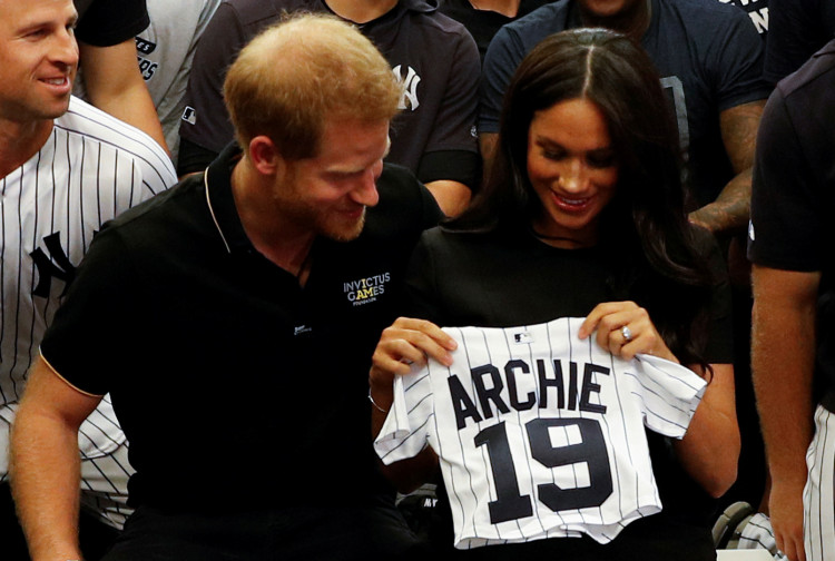 FILE PHOTO: Britain's Prince Harry and Meghan, Duchess of Sussex attend the Boston Red Sox v New York Yankees match in London