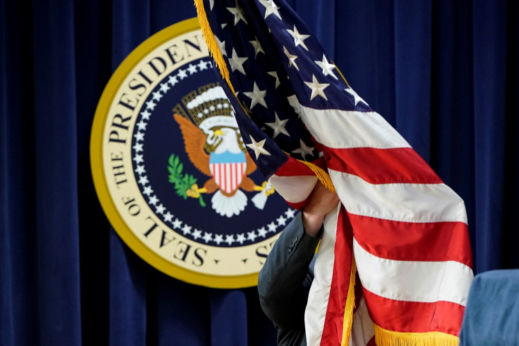 A U.S. flag is put into position before U.S. President Donald Trump arrived to address the "White House Summit on Transforming Mental Health Treatment to Combat Homelessness, Violence, & Substance Abuse" 