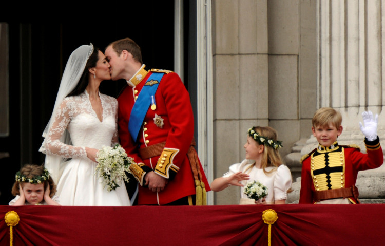 FILE PHOTO: Britain's Prince William and his wife Catherine, Duchess of Cambridge, kiss on the balcony at Buckingham Palace after their wedding in Westminster Abbey in London