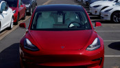 FILE PHOTO: A new Tesla Model 3 is shown at a delivery center on the last day of the company's third quarter, in San Diego