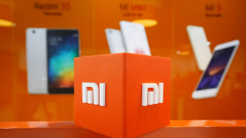 FILE PHOTO: The logo of Xiaomi is seen inside the company's office in Bengaluru