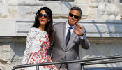 FILE PHOTO: U.S. actor George Clooney and his wife Amal Alamuddin leave the seven-star hotel Aman Canal Grande Venice in Venice September 28, 2014. REUTERS/Stefano Rellandini/File Photo