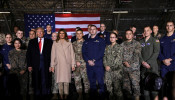 U.S. President Donald Trump and first lady Melania Trump pose for a group photo at a signing ceremony of the 