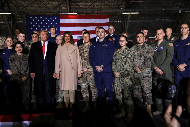 U.S. President Donald Trump and first lady Melania Trump pose for a group photo at a signing ceremony of the "National Defense Authorization Act for Fiscal Year 2020" at Joint Base Andrews