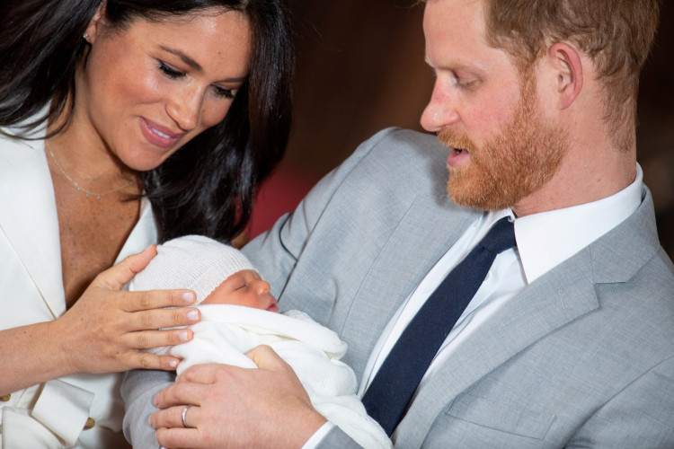 FILE PHOTO: Britain's Prince Harry and Meghan, Duchess of Sussex with their baby son at Windsor Castle