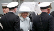 Camilla, Duchess of Cornwall, uses an umbrella as she leaves following the official commissioning ceremony of HMS Prince of Wales, in Portsmouth, Britain, December 10, 2019. Andrew Matthres/PA Wire/Pool via REUTERS