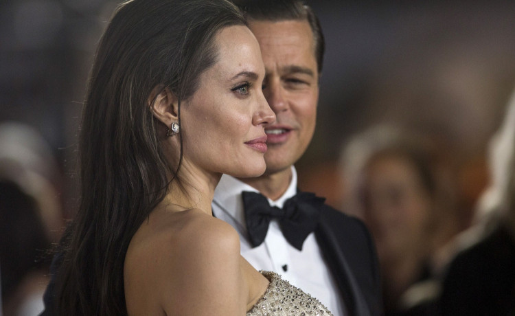 FILE PHOTO: Director and cast member Jolie and her husband and co-star Pitt pose at the premiere of "By the Sea" during the opening night of AFI FEST 2015 in Hollywood