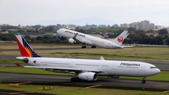 A Japan Airlines Boeing 767 plane takes off