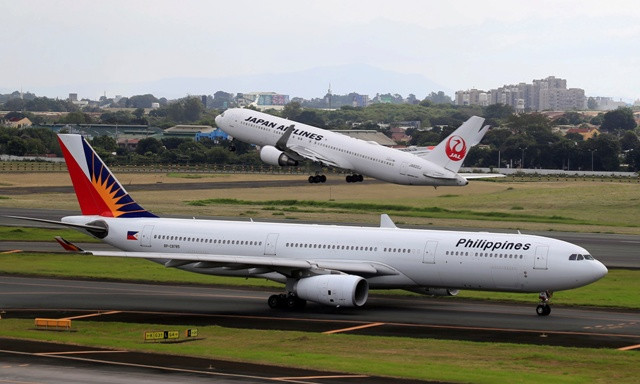 A Japan Airlines Boeing 767 plane takes off