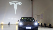 China-made Tesla Model 3 vehicle is seen at a delivery ceremony in the Shanghai Gigafactory of the U.S. electric car maker