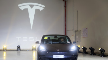 China-made Tesla Model 3 vehicle is seen at a delivery ceremony in the Shanghai Gigafactory of the U.S. electric car maker