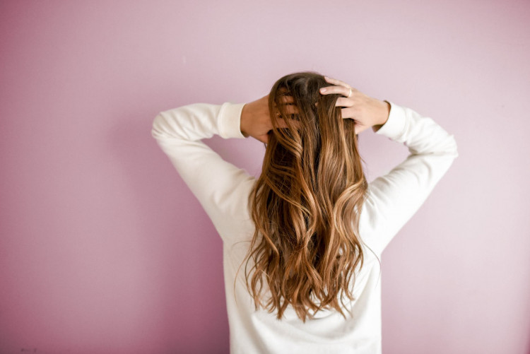Woman wearing white long sleeves.