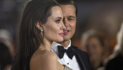 FILE PHOTO: Director and cast member Jolie and her husband and co-star Pitt pose at the premiere of 