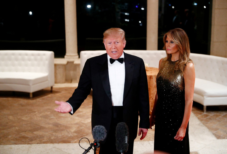 U.S. President Donald Trump accompanied by first lady Melania Trump, speaks to the press at the Mar-a-Lago resort in Palm Beach