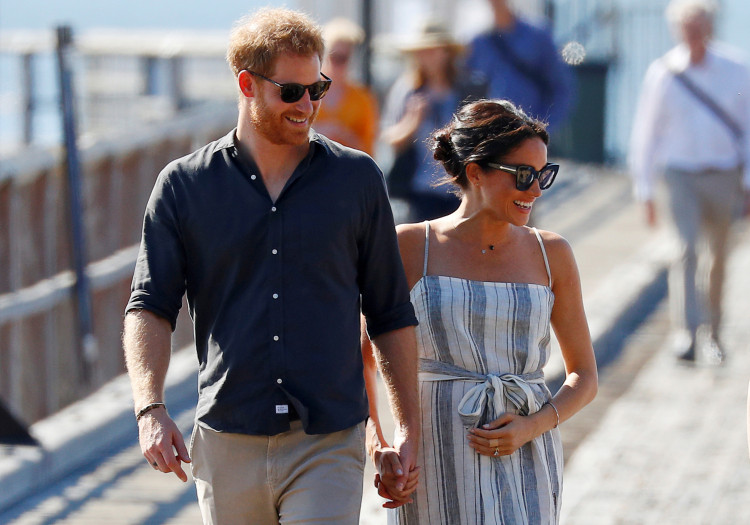 FILE PHOTO: Britain's Prince Harry and Meghan, Duchess of Sussex, arrive to greet members of the public in Kingfisher Bay on Fraser Island in Queensland